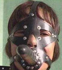 Strong leather mask with attached leather dildo. Clip on/off eye closures, not shown. Available in black only.  