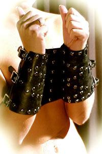 Strong leather handcuffs with buckles and studs